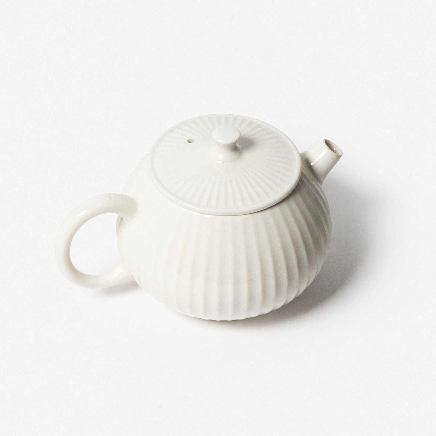 A refined Dehua porcelain teaware and tableware piece, crafted in the kilns of Fujian with a legacy dating back to ancient China; this minimalist yet culturally rich ceramic reflects the purity of Eastern craftsmanship, blending seamlessly into modern interiors inspired by Chinese tradition, ritual, and timeless design. Hog Lane, London Based Chinese homeware UK