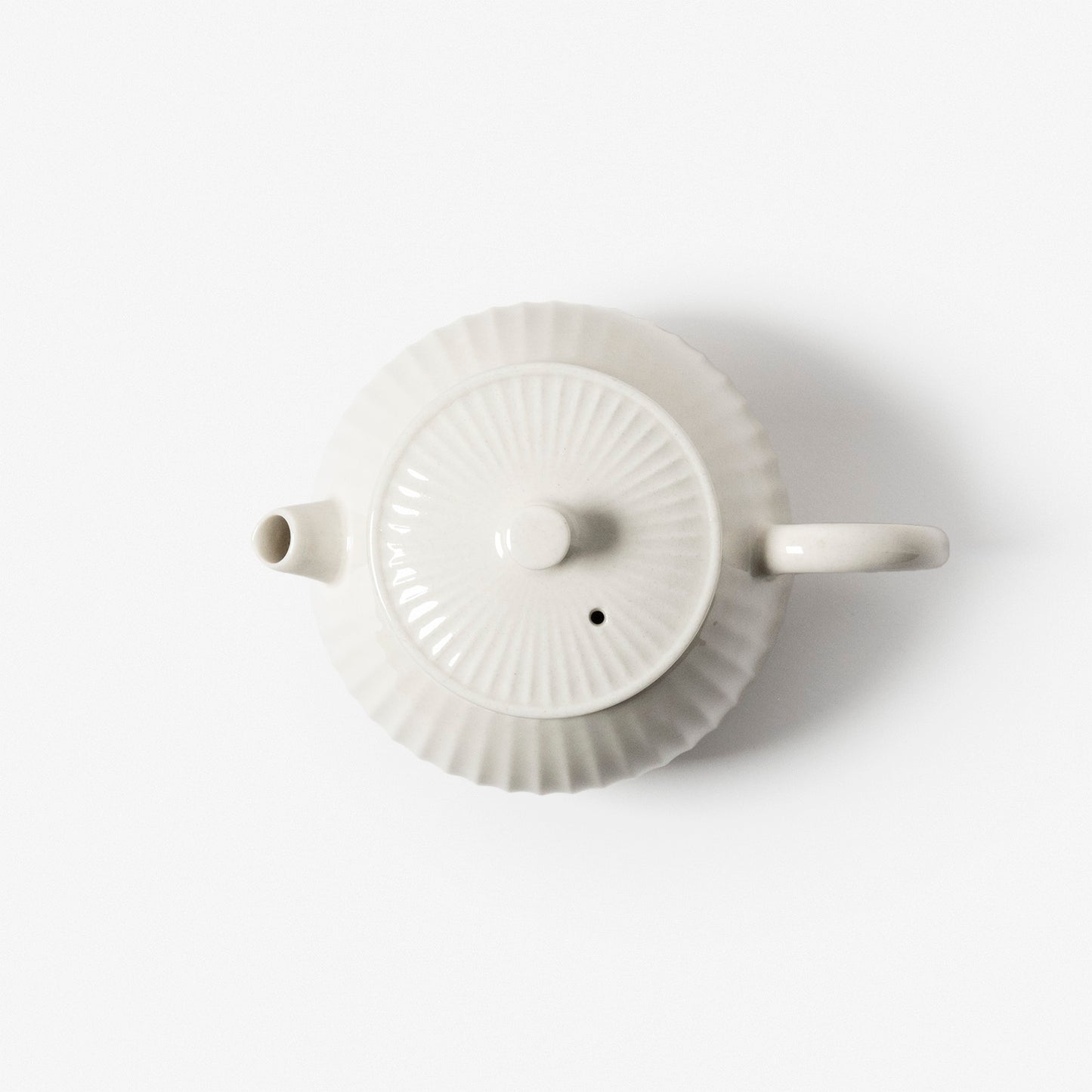 A refined Dehua porcelain teaware and tableware piece, crafted in the kilns of Fujian with a legacy dating back to ancient China; this minimalist yet culturally rich ceramic reflects the purity of Eastern craftsmanship, blending seamlessly into modern interiors inspired by Chinese tradition, ritual, and timeless design. Hog Lane, London Based Chinese homeware UK