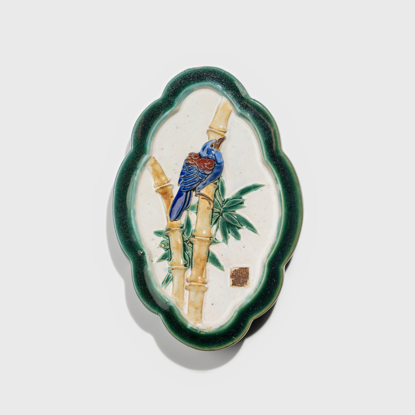 Shiwan handcrafted ceramic wall art depicting bamboo, traditional Chinese hanging vase with Cantonese glaze technique.