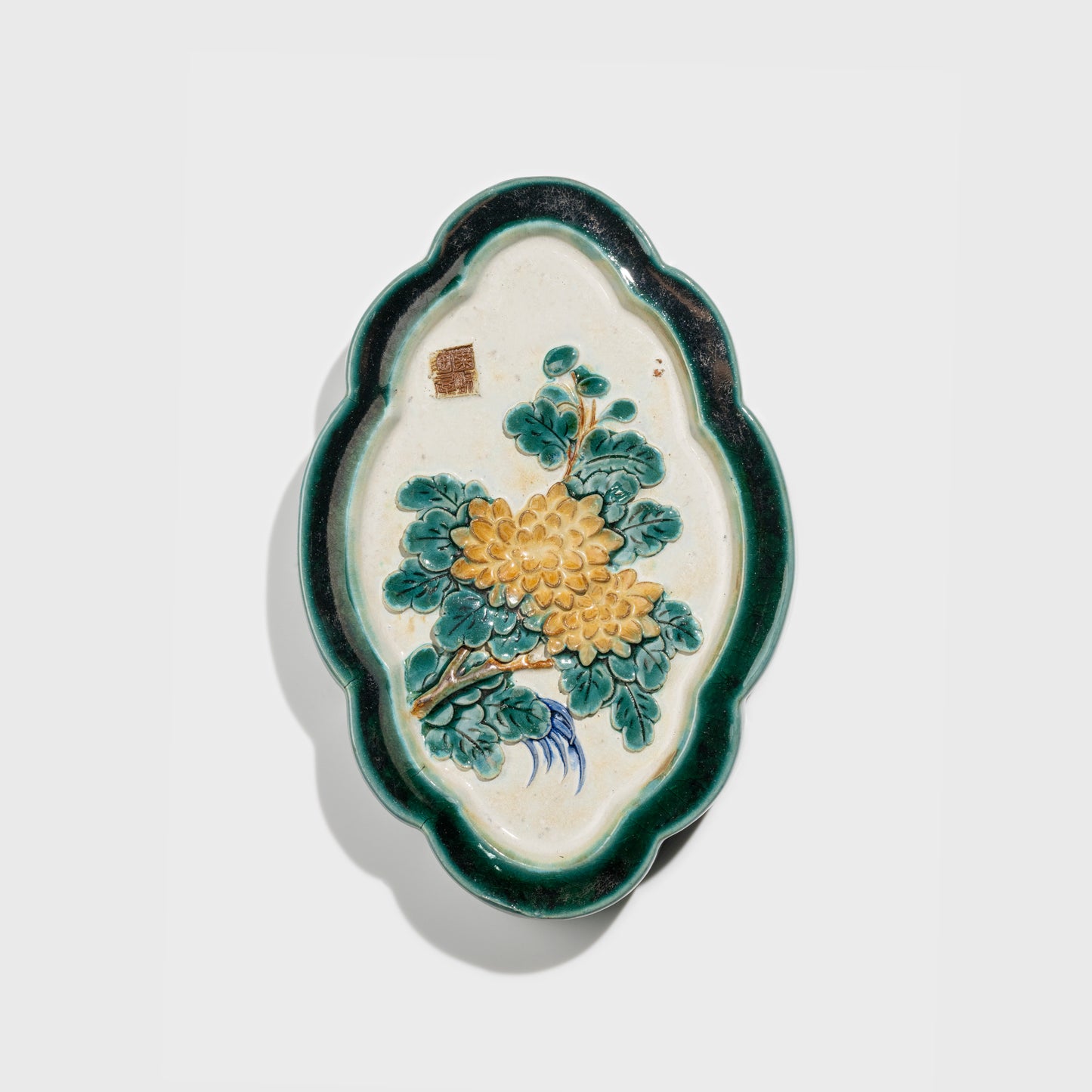 Shiwan handcrafted ceramic wall art depicting chrysanthemums, traditional Chinese hanging vase with Cantonese glaze technique.