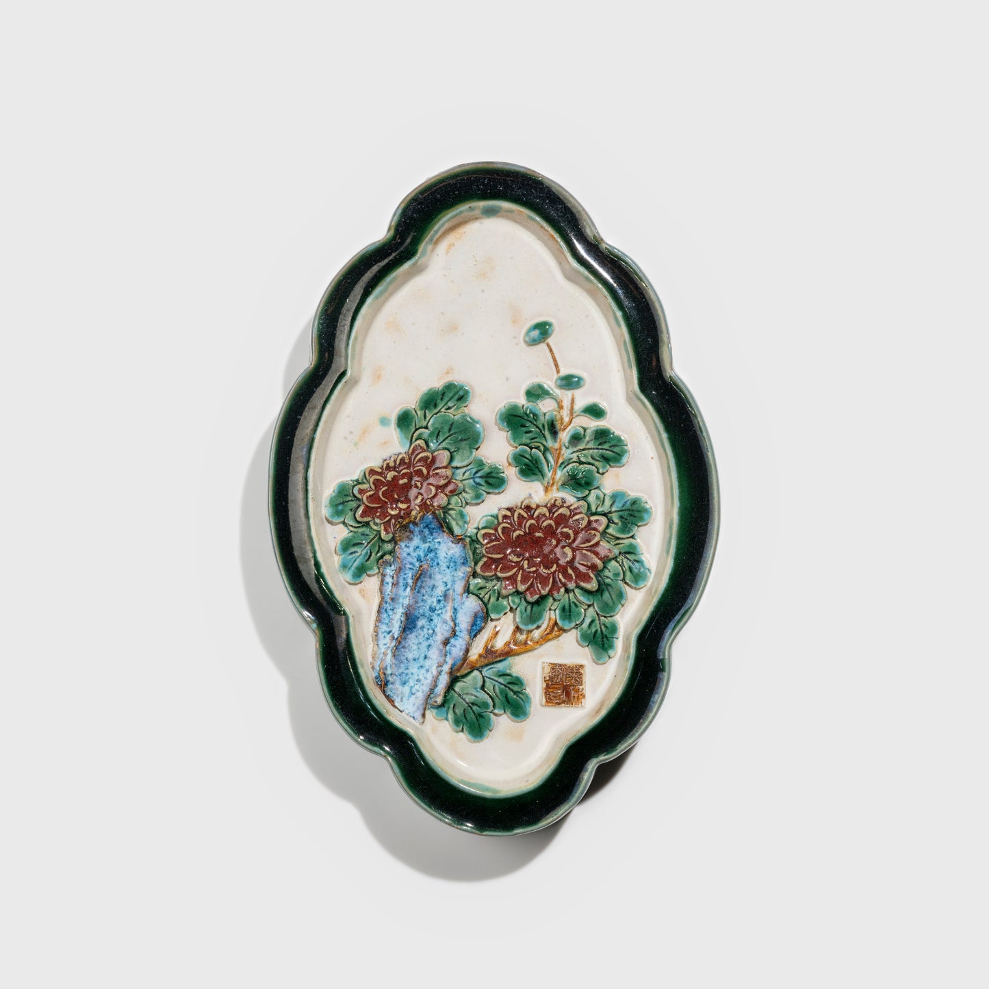 Shiwan handcrafted ceramic wall art depicting chrysanthemums, traditional Chinese hanging vase with Cantonese glaze technique.