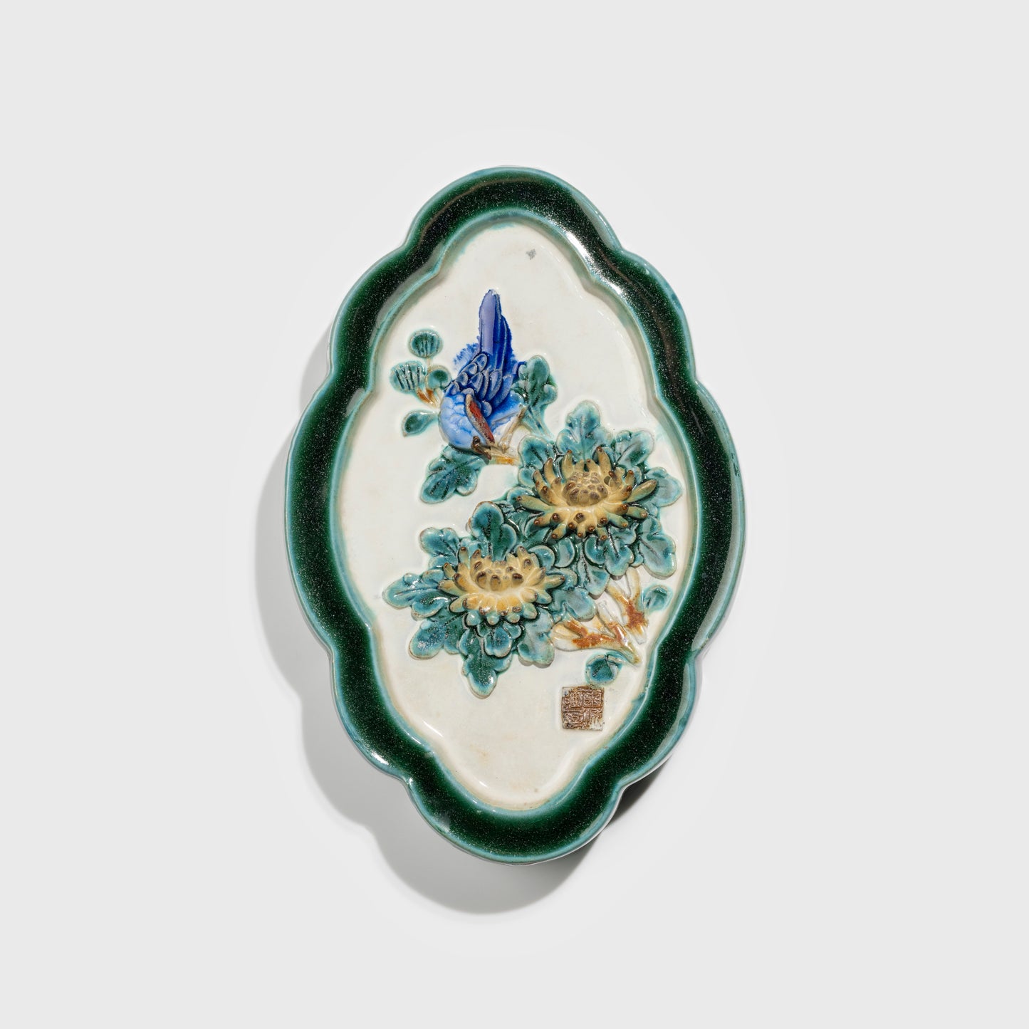 Shiwan handcrafted ceramic wall art depicting chrysanthemums, traditional Chinese hanging vase with Cantonese glaze technique.