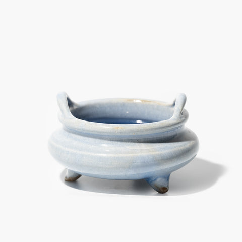 Sky Blue Tripod Incense Burner, HOG LANE, A handcrafted Shiwan ceramic piece made using traditional kiln-fired techniques from southern China, showcasing the unique glaze patterns, symbolic forms, and sculptural artistry rooted in Cantonese heritage; this oriental decorative item brings timeless Chinese craftsmanship and cultural elegance into modern interior spaces.

Collectible with traditional Chinese glaze and cultural symbolism, ideal for antique lovers and oriental art collectors.