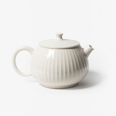 A refined Dehua porcelain teaware and tableware piece, crafted in the kilns of Fujian with a legacy dating back to ancient China; this minimalist yet culturally rich ceramic reflects the purity of Eastern craftsmanship, blending seamlessly into modern interiors inspired by Chinese tradition, ritual, and timeless design. Hog Lane, London Based Chinese homeware UK