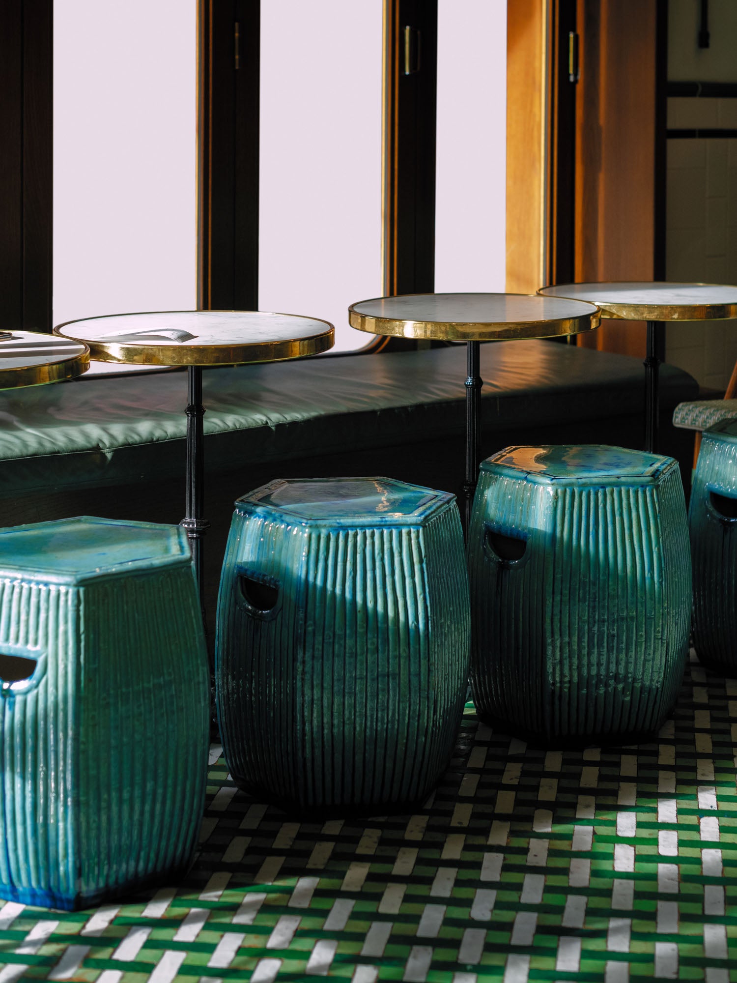 Green ceramic stool with bamboo motif in London Restaurant– handcrafted by Hog Lane.