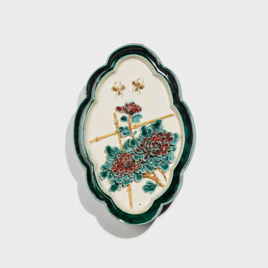 Shiwan handcrafted ceramic wall art depicting chrysanthemums, traditional Chinese hanging vase with Cantonese glaze technique.