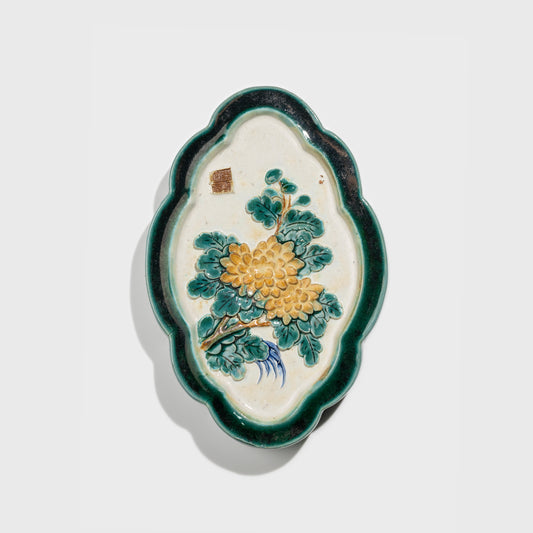 Shiwan handcrafted ceramic wall art depicting chrysanthemums, traditional Chinese hanging vase with Cantonese glaze technique.