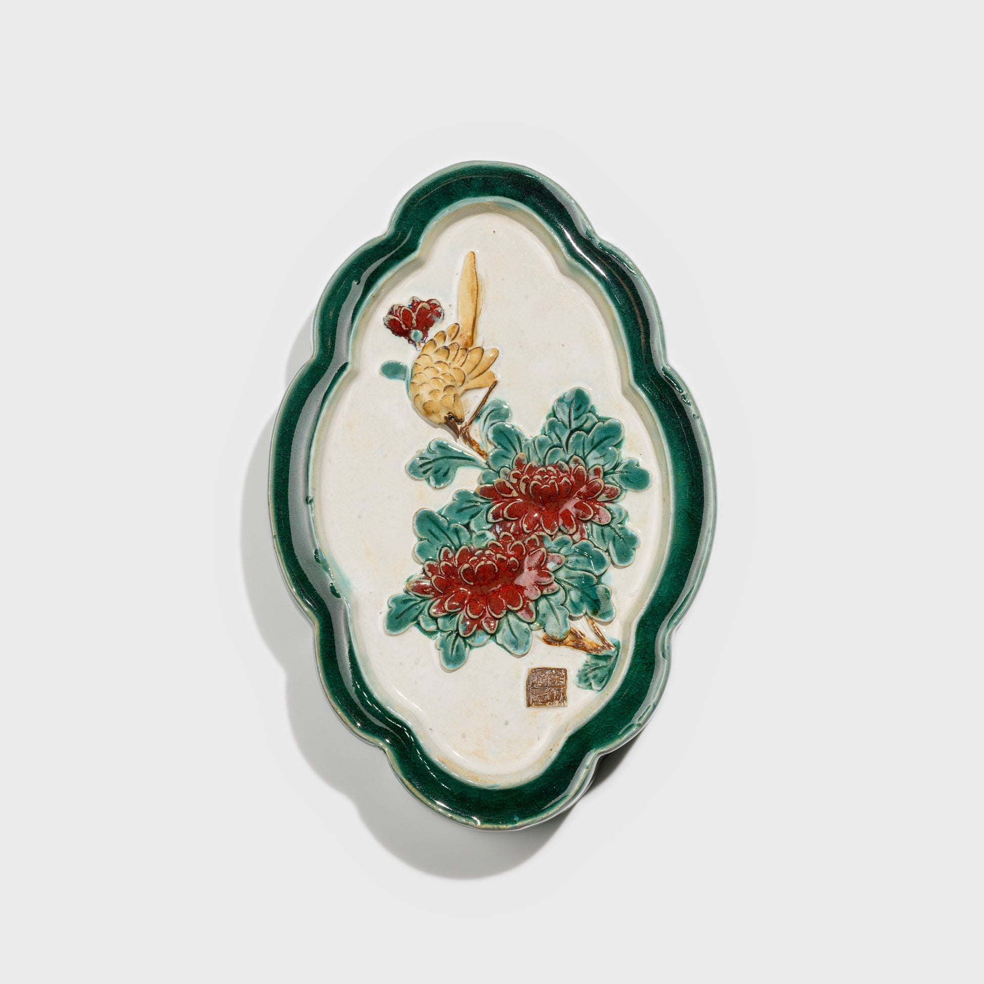 Shiwan handcrafted ceramic wall art depicting chrysanthemums, traditional Chinese hanging vase with Cantonese glaze technique.