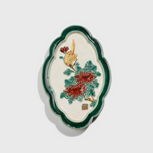 Shiwan handcrafted ceramic wall art depicting chrysanthemums, traditional Chinese hanging vase with Cantonese glaze technique.