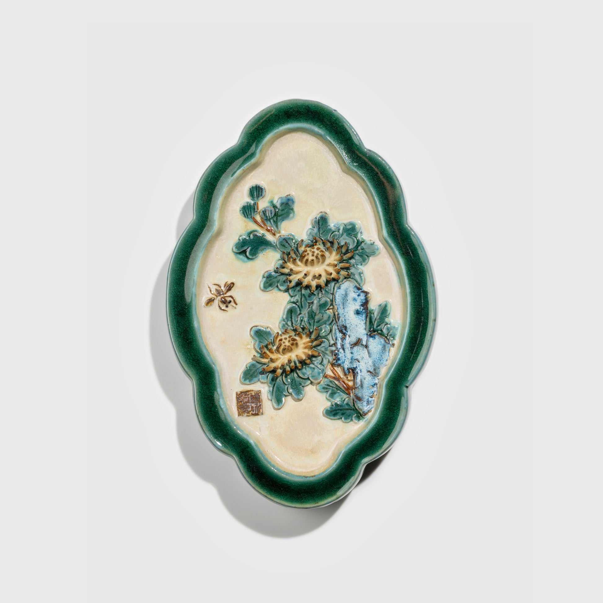 Shiwan handcrafted ceramic wall art depicting chrysanthemums, traditional Chinese hanging vase with Cantonese glaze technique.