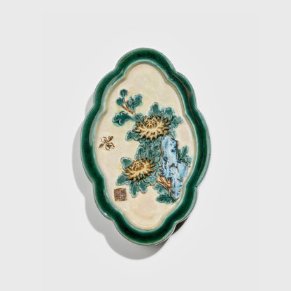 Shiwan handcrafted ceramic wall art depicting chrysanthemums, traditional Chinese hanging vase with Cantonese glaze technique.