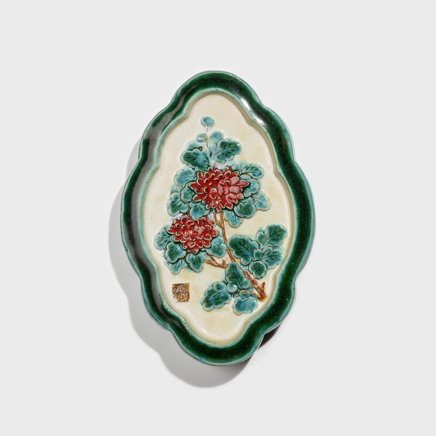 Shiwan handcrafted ceramic wall art depicting chrysanthemums, traditional Chinese hanging vase with Cantonese glaze technique.