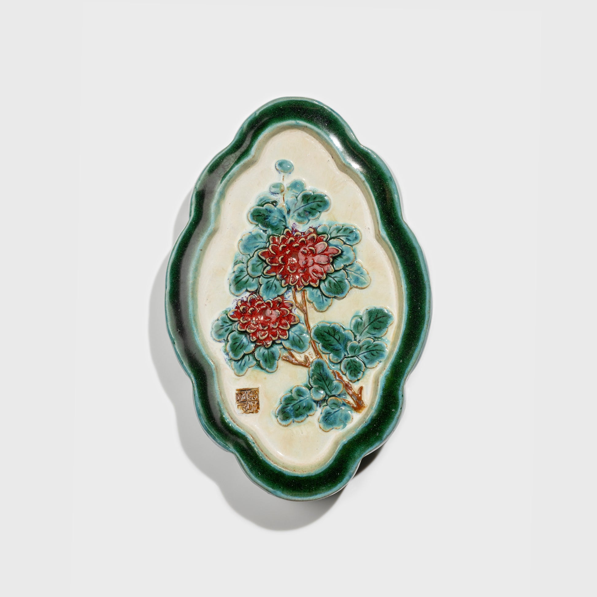 Shiwan handcrafted ceramic wall art depicting chrysanthemums, traditional Chinese hanging vase with Cantonese glaze technique.