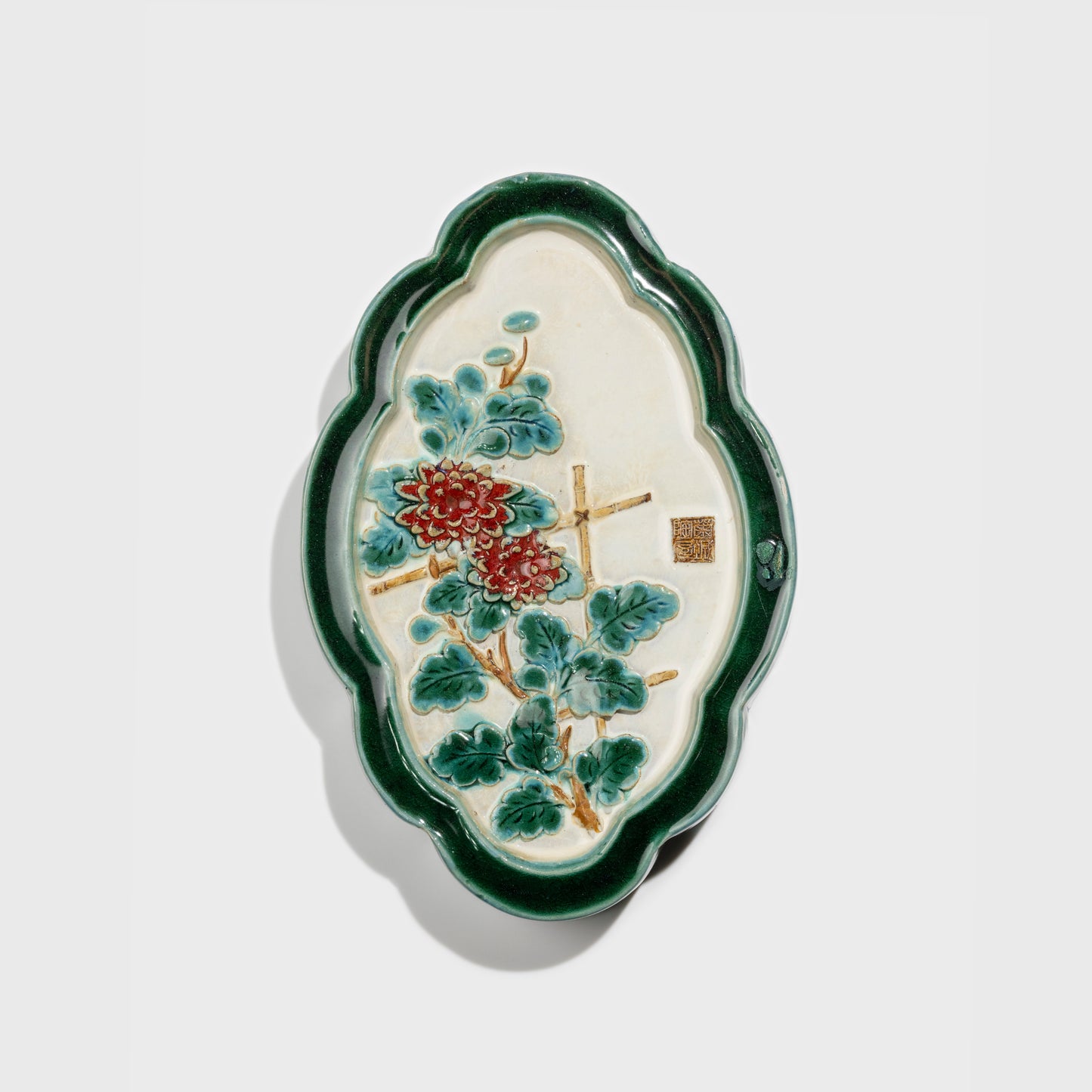 Shiwan handcrafted ceramic wall art depicting chrysanthemums, traditional Chinese hanging vase with Cantonese glaze technique.