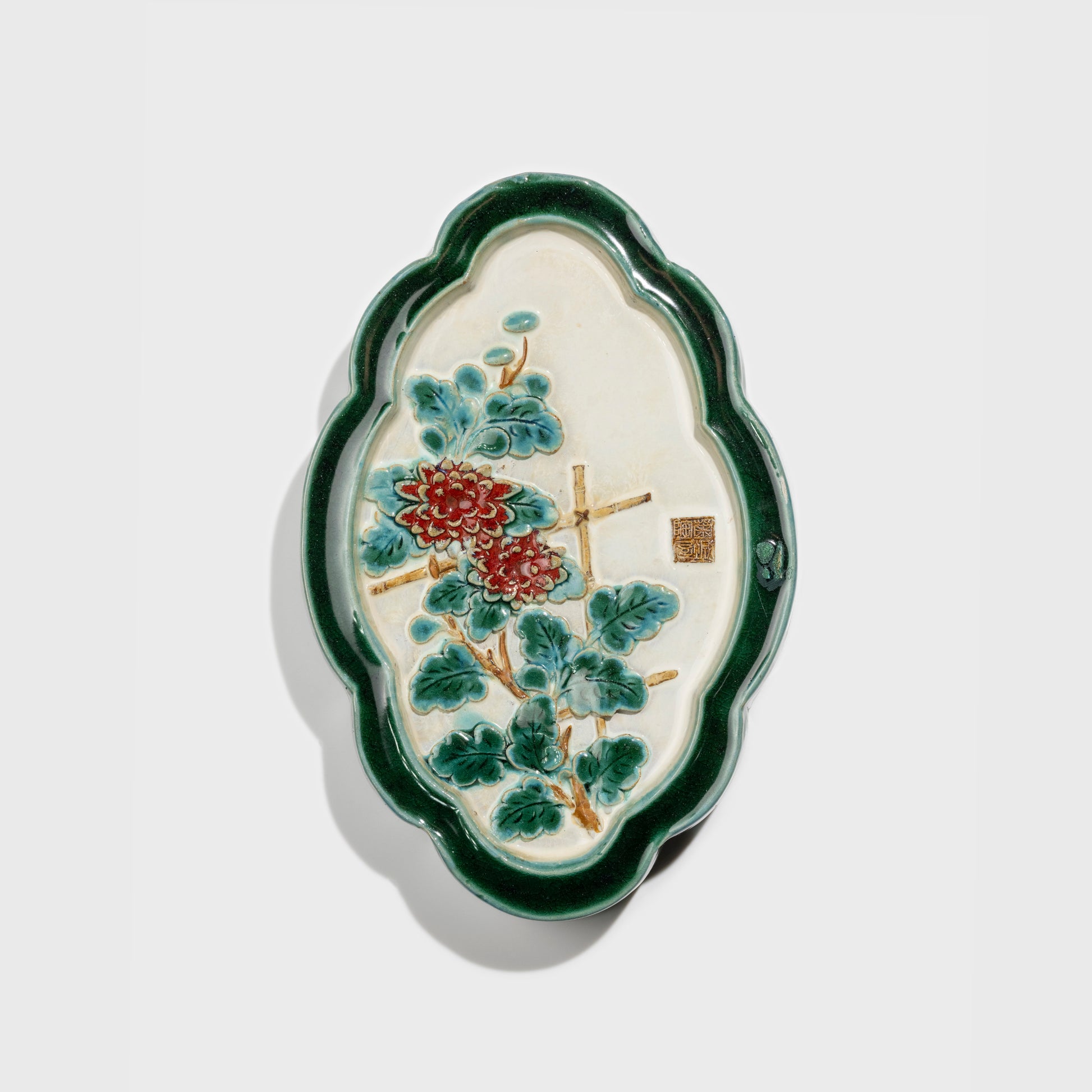 Shiwan handcrafted ceramic wall art depicting chrysanthemums, traditional Chinese hanging vase with Cantonese glaze technique.