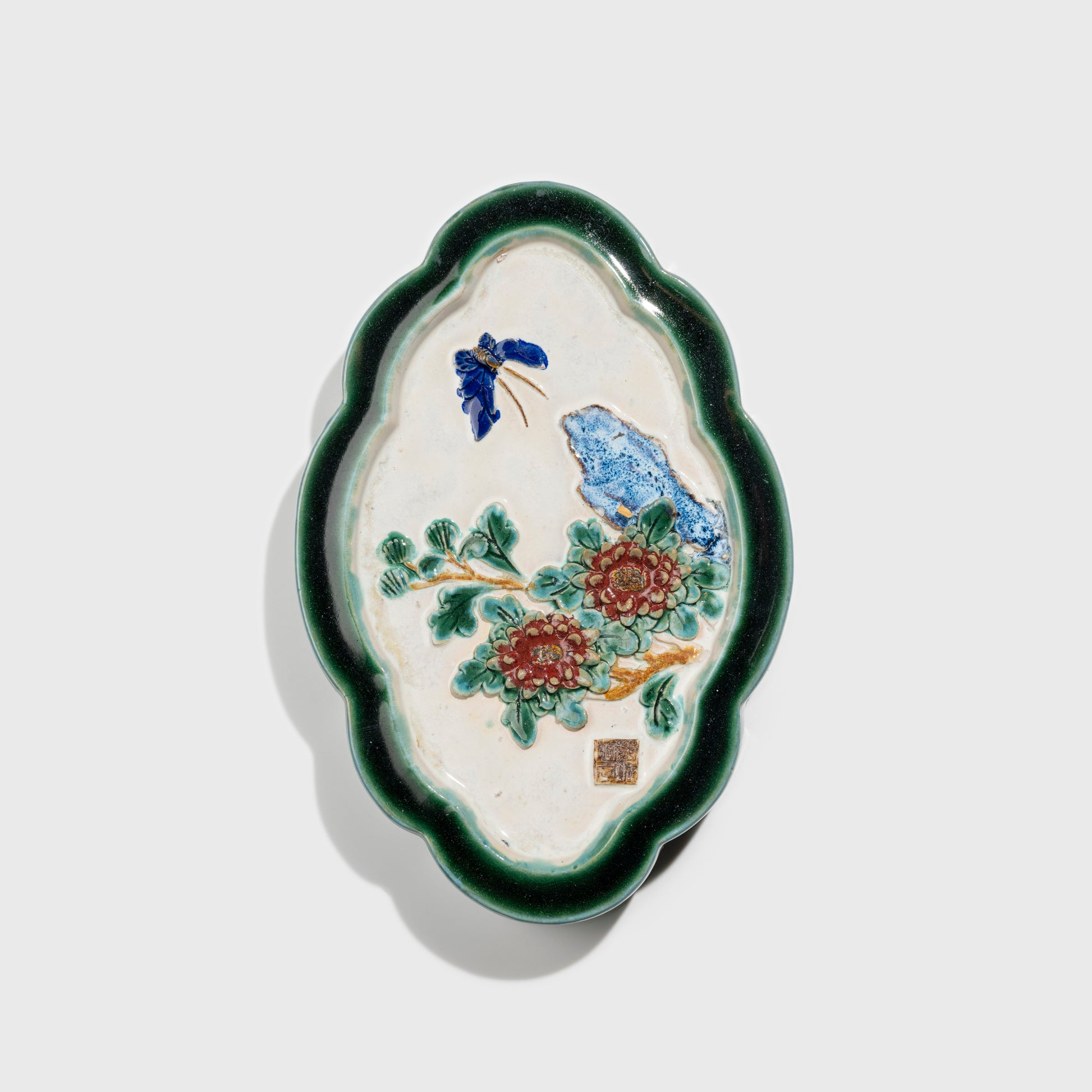 Shiwan handcrafted ceramic wall art depicting chrysanthemums, traditional Chinese hanging vase with Cantonese glaze technique.
