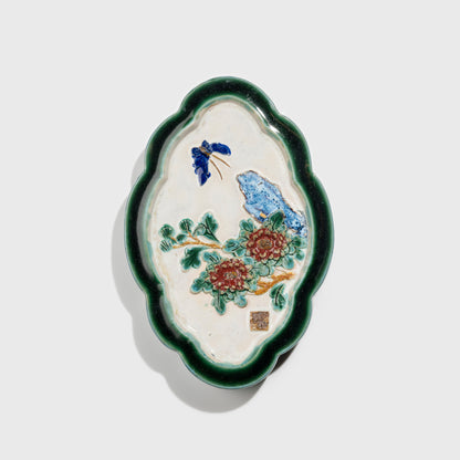 Shiwan handcrafted ceramic wall art depicting chrysanthemums, traditional Chinese hanging vase with Cantonese glaze technique.