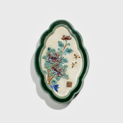 Shiwan handcrafted ceramic wall art depicting chrysanthemums, traditional Chinese hanging vase with Cantonese glaze technique.