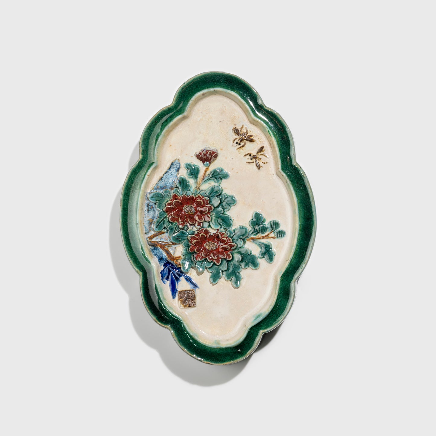 Shiwan handcrafted ceramic wall art depicting chrysanthemums, traditional Chinese hanging vase with Cantonese glaze technique.