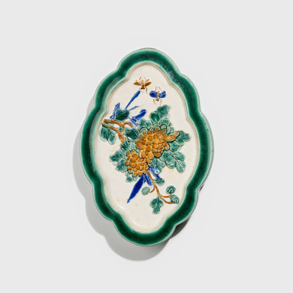 Shiwan handcrafted ceramic wall art depicting chrysanthemums, traditional Chinese hanging vase with Cantonese glaze technique.