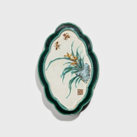 Shiwan handcrafted ceramic wall art depicting orchid, traditional Chinese hanging vase with Cantonese glaze technique.