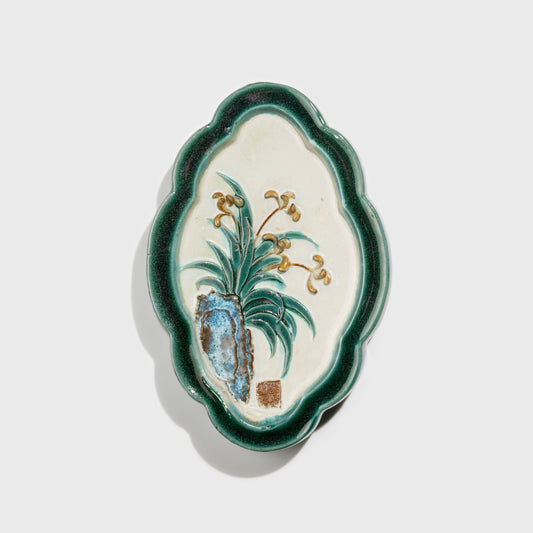Shiwan handcrafted ceramic wall art depicting orchid, traditional Chinese hanging vase with Cantonese glaze technique.