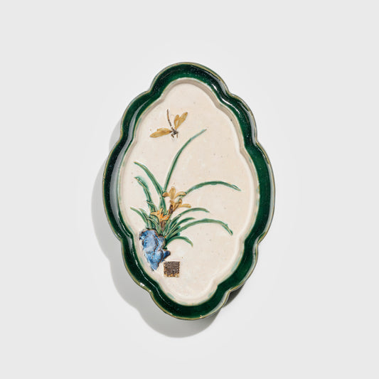 Shiwan handcrafted ceramic wall art depicting orchid, traditional Chinese hanging vase with Cantonese glaze technique.