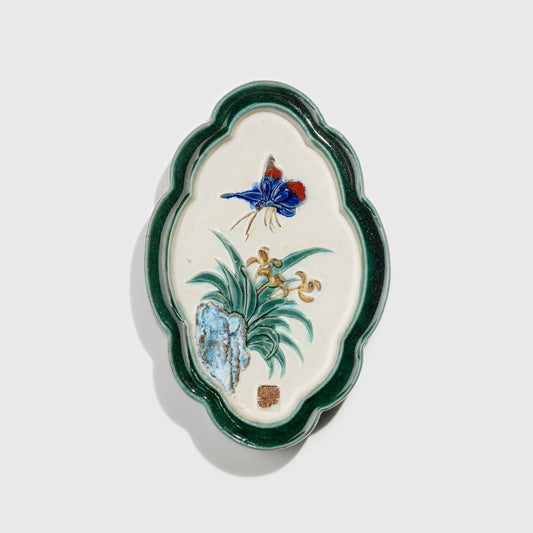Shiwan handcrafted ceramic wall art depicting orchid, traditional Chinese hanging vase with Cantonese glaze technique.