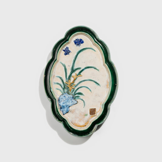 Shiwan handcrafted ceramic wall art depicting orchid, traditional Chinese hanging vase with Cantonese glaze technique.