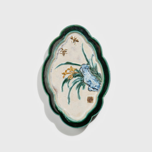 Shiwan handcrafted ceramic wall art depicting orchid, traditional Chinese hanging vase with Cantonese glaze technique.
