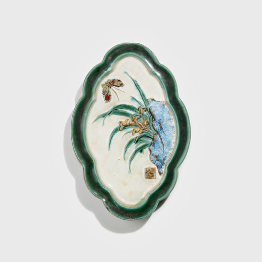 Shiwan handcrafted ceramic wall art depicting orchid, traditional Chinese hanging vase with Cantonese glaze technique.