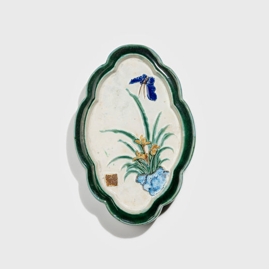 Shiwan handcrafted ceramic wall art depicting orchid, traditional Chinese hanging vase with Cantonese glaze technique.