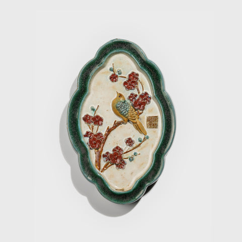 Shiwan handcrafted ceramic wall art depicting plum blossoms, traditional Chinese hanging vase with Cantonese glaze technique.