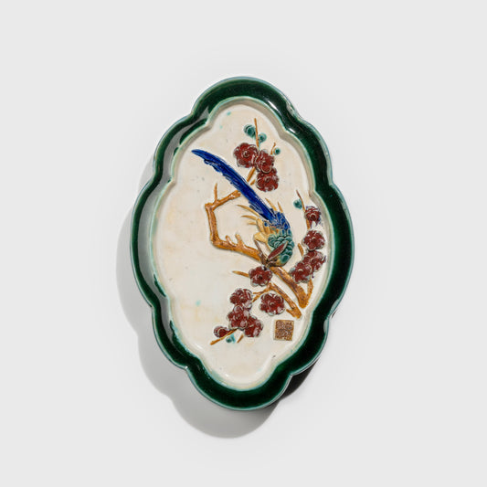 Shiwan handcrafted ceramic wall art depicting plum blossoms, traditional Chinese hanging vase with Cantonese glaze technique.