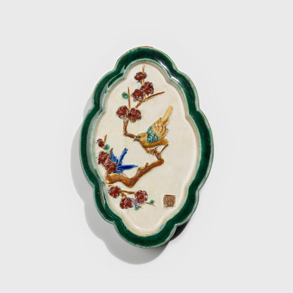Shiwan handcrafted ceramic wall art depicting plum blossoms, traditional Chinese hanging vase with Cantonese glaze technique.