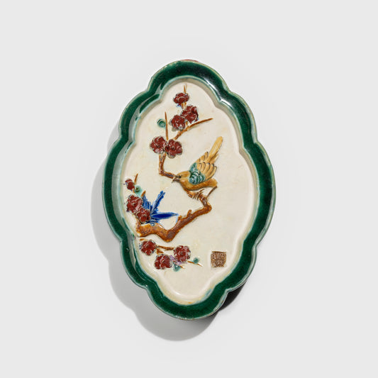 Shiwan handcrafted ceramic wall art depicting plum blossoms, traditional Chinese hanging vase with Cantonese glaze technique.