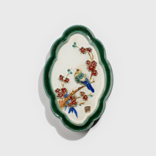 Shiwan handcrafted ceramic wall art depicting plum blossoms, traditional Chinese hanging vase with Cantonese glaze technique.