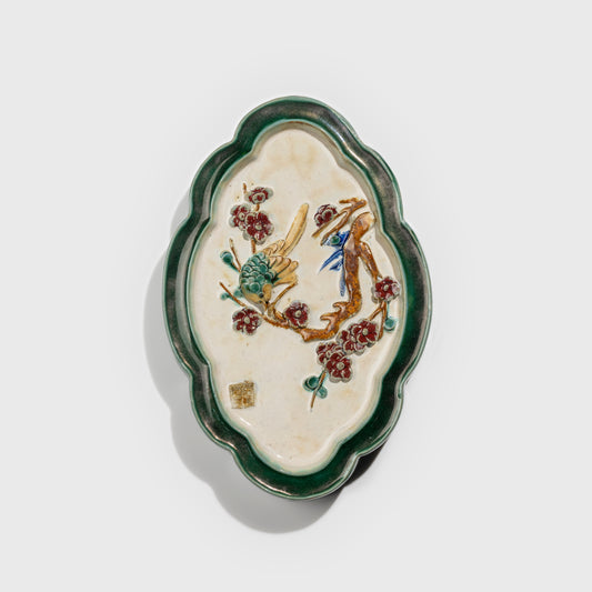 Shiwan handcrafted ceramic wall art depicting plum blossoms, traditional Chinese hanging vase with Cantonese glaze technique.