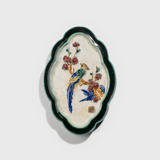 Shiwan handcrafted ceramic wall art depicting plum blossoms, traditional Chinese hanging vase with Cantonese glaze technique.