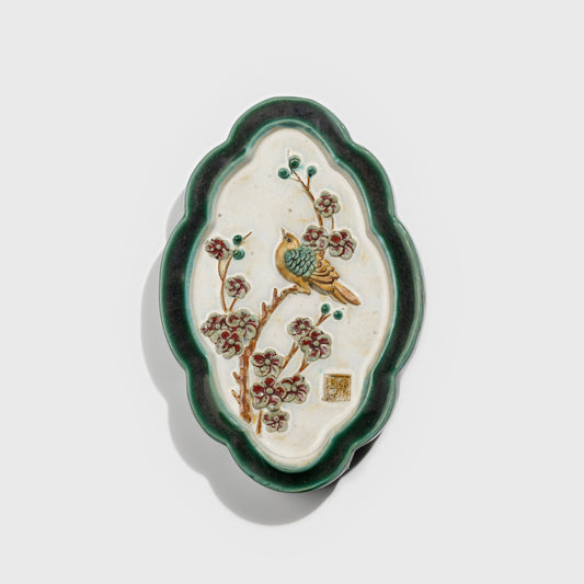 Shiwan handcrafted ceramic wall art depicting plum blossoms, traditional Chinese hanging vase with Cantonese glaze technique.
