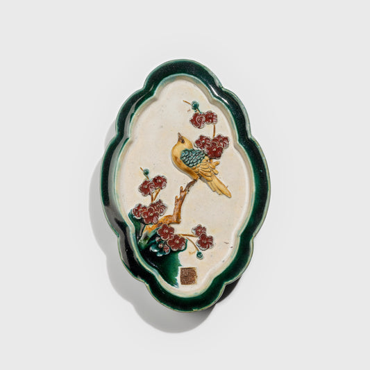 Shiwan handcrafted ceramic wall art depicting plum blossoms, traditional Chinese hanging vase with Cantonese glaze technique.